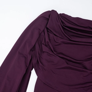 Detailed view of dark purple sleeveless bodysuit featuring elegant draped neckline fabric