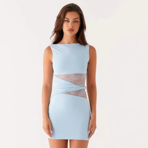 Detail of light blue sleeveless dress with lace waist cut-out and twisted fabric design