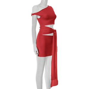 Detail of red off-shoulder mini dress featuring unique side cut-outs and wrap-around ties