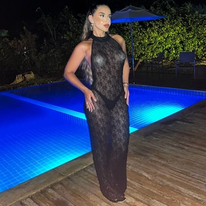Detail of sheer floral lace texture on a black backless halter maxi dress for women