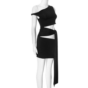 Detail of black one-shoulder dress featuring waist cutout and flowing side ribbon