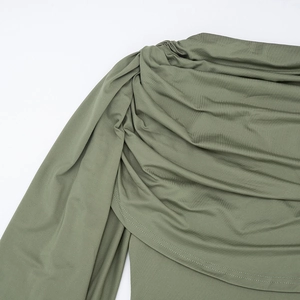 Detail of olive green sleeveless bodysuit featuring elegant draped neckline and ribbed fabric
