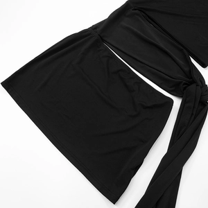 Detail of black mini dress with adjustable long tie straps and smooth elastic fabric