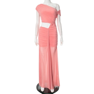 Detail of coral pink one-shoulder dress featuring waist cut-out and pleated mesh fabric