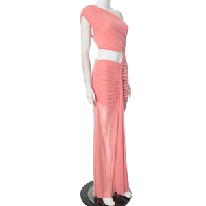 Detail of coral orange one-shoulder maxi dress featuring waist cutout and ruched fabric