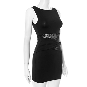 Close-up of sleeveless black mini dress featuring lace patchwork and waist twist detail