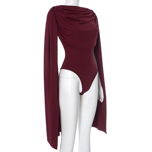 Detail of burgundy bodysuit featuring a draped neckline and elegant cape sleeves design