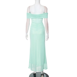 Detail view of the mint green off-shoulder dress featuring ruched back and mesh fabric