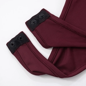 Detail of burgundy ribbed bodysuit with black metal snap buttons for easy closure