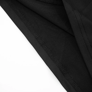 Detailed view of the fine knit fabric texture and smooth stitching on the black dress hem