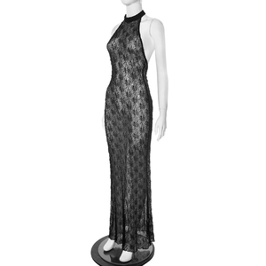Detail of the backless design and intricate lace texture on the black halter maxi dress