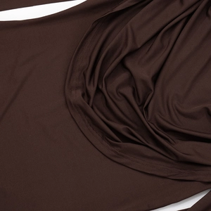 Detail of cowl neck draped design on dark brown modal dress with fine stitching