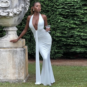 Detailed ruching and flowing ribbon on a white halter neck deep V-neck maxi dress