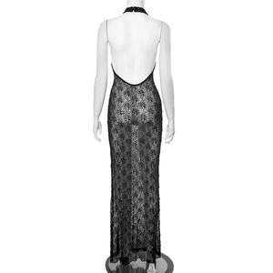 Detailed view of the backless design and intricate floral lace on this black maxi dress