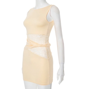 Detailed view of apricot sleeveless dress featuring white lace patchwork and waist twist design