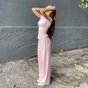 Side view of soft pink casual two-piece set featuring long pants and round neck top