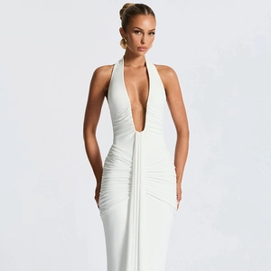 Detail of elegant white halter neck maxi dress with V-neckline and ruching detail