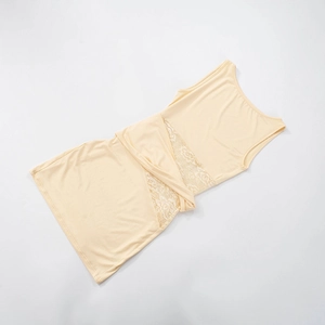 Detail of waist twist knot and lace splicing on a beige sleeveless summer dress