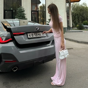 Pink two-piece set featuring short sleeve round neck tee and high waist wide leg pants