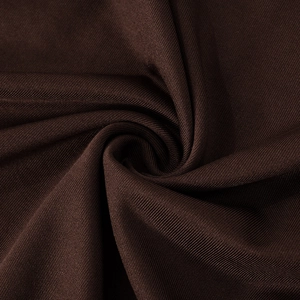 Detailed macro view of dark coffee brown ribbed knit fabric texture and soft material
