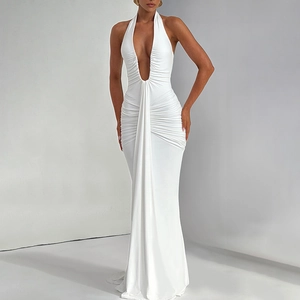 Detail of elegant white halter neck maxi dress with deep V-neck and ruched pleated fabric