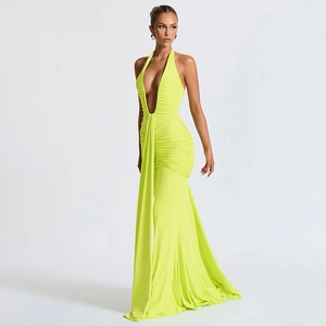 Detail of elegant lime green halter neck maxi dress with ruched waist and drape detail