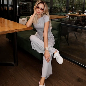 Detail view of light grey round neck short sleeve top and high waist wide leg pants set