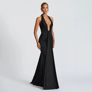 Detail of elegant black halter deep V-neck maxi dress with ruched waist and fishtail hem