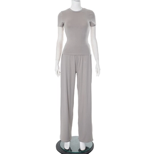 Close-up of gray two-piece set featuring a round neck top and high waist wide leg pants