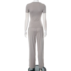 Rear view of a light gray two-piece set featuring short sleeve top and wide leg pants