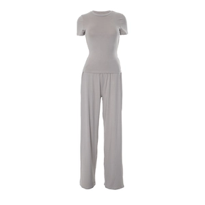 Detailed view of light grey two-piece set featuring short sleeve top and wide leg pants
