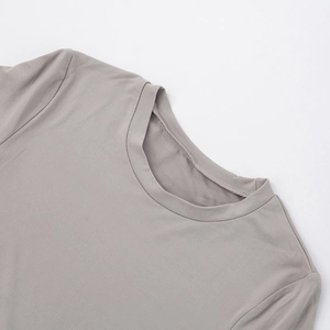 Detailed view of grey crew neck t-shirt showing double-stitched neckline and fabric texture