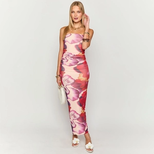Detail of floral print strapless maxi dress with pink and purple blossoms and smocked waist