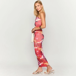 Detailed side view of strapless floral maxi dress with vibrant pink flower patterns