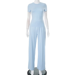 Detail of light blue two-piece set featuring short sleeve top and wide leg pants