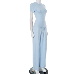 Detailed side view of light blue loungewear set with round neck top and wide leg pants