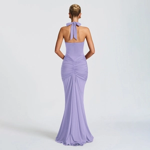 Detailed back view of lilac halter maxi dress featuring bow tie and ruched pleated fabric