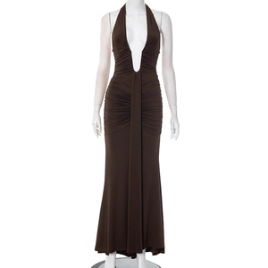Detail of elegant dark brown halter neck maxi dress with ruched waist and fishtail hem