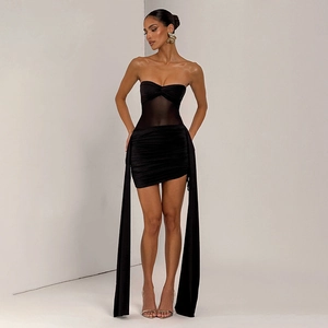 Detail showing the sheer mesh paneling and long decorative sashes on the black bodycon dress