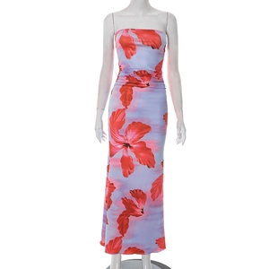 Detail of ruched floral bandeau maxi dress with large red prints on light purple fabric