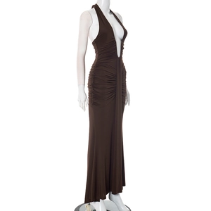 Detail of elegant backless halter neck maxi dress with side ruching and V-neckline