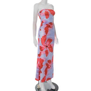 Detailed view of the side ruching and red floral hibiscus pattern on this tube dress