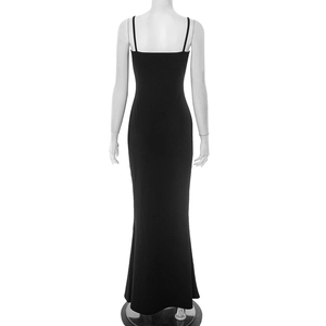 Detail of the back view of a slim fit black maxi dress with elegant thin straps