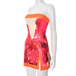 Detail view of floral print tube dress with side slit and vibrant orchid patterns