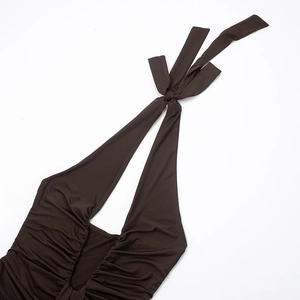 Detail of elegant dark coffee halter neck maxi dress with ruched design and tie-up neckline