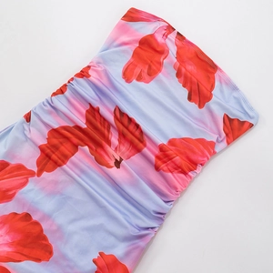 Detail view of floral print fabric with side ruching on a blue strapless dress