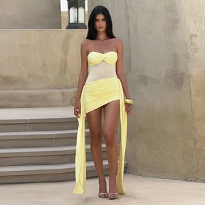 Detail of yellow tube mini dress with sheer mesh waist panel and long side ribbons