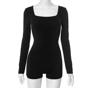 Close-up of black U-neck long sleeve romper showing flexible ribbed fabric and clean seams