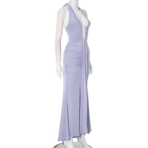 Detail of lavender halter neck maxi dress featuring pleated side and backless design