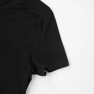 Close-up of crew neckline and soft fabric texture on black long sleeve loungewear top